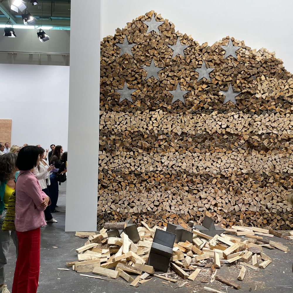 Sculptural work in a gallery booth at Art Basel, crafted from wood and steel by Danh Vo