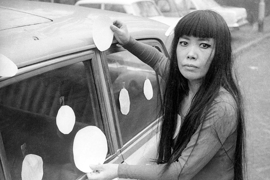 Yayoi Kusama surrounded by her artwork