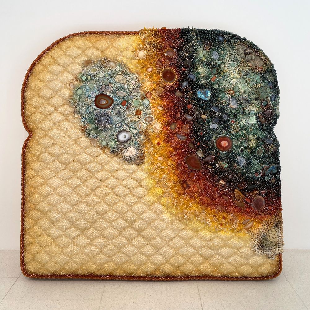 Artistic depiction of a slice of bread with a crystal design on a white background Kathleen Ryan's Roman Meal at Gagosian