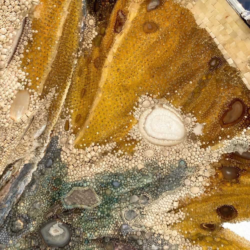 Close-up of a textured surface with various colors and patterns Kathleen Ryan's Roman Meal at Gagosian