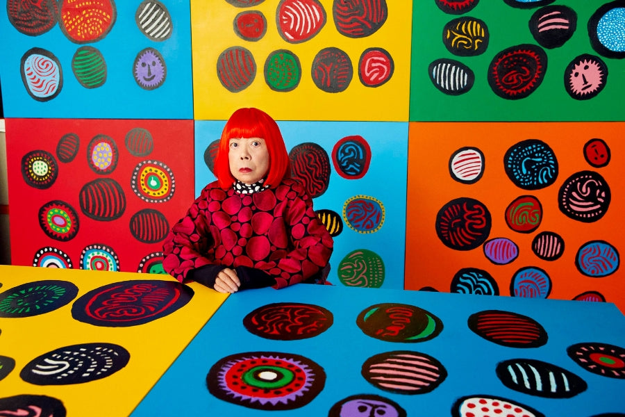 Yayoi Kusama surrounded by her artwork
