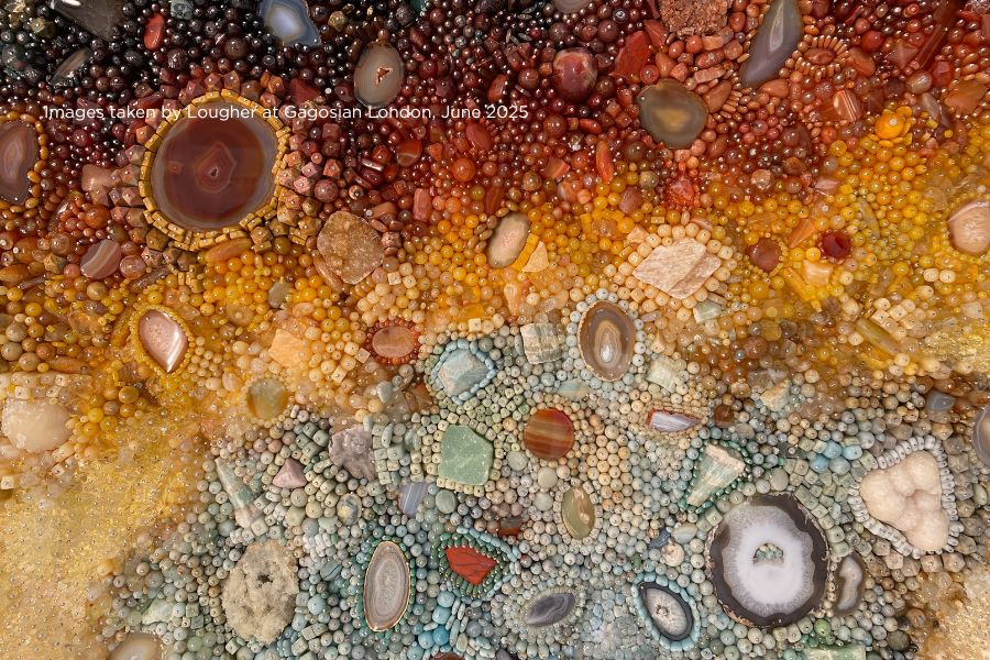 Close-up of a textured surface with various colored stones and pebbles. Kathleen Ryan's Roman Meal at Gagosian