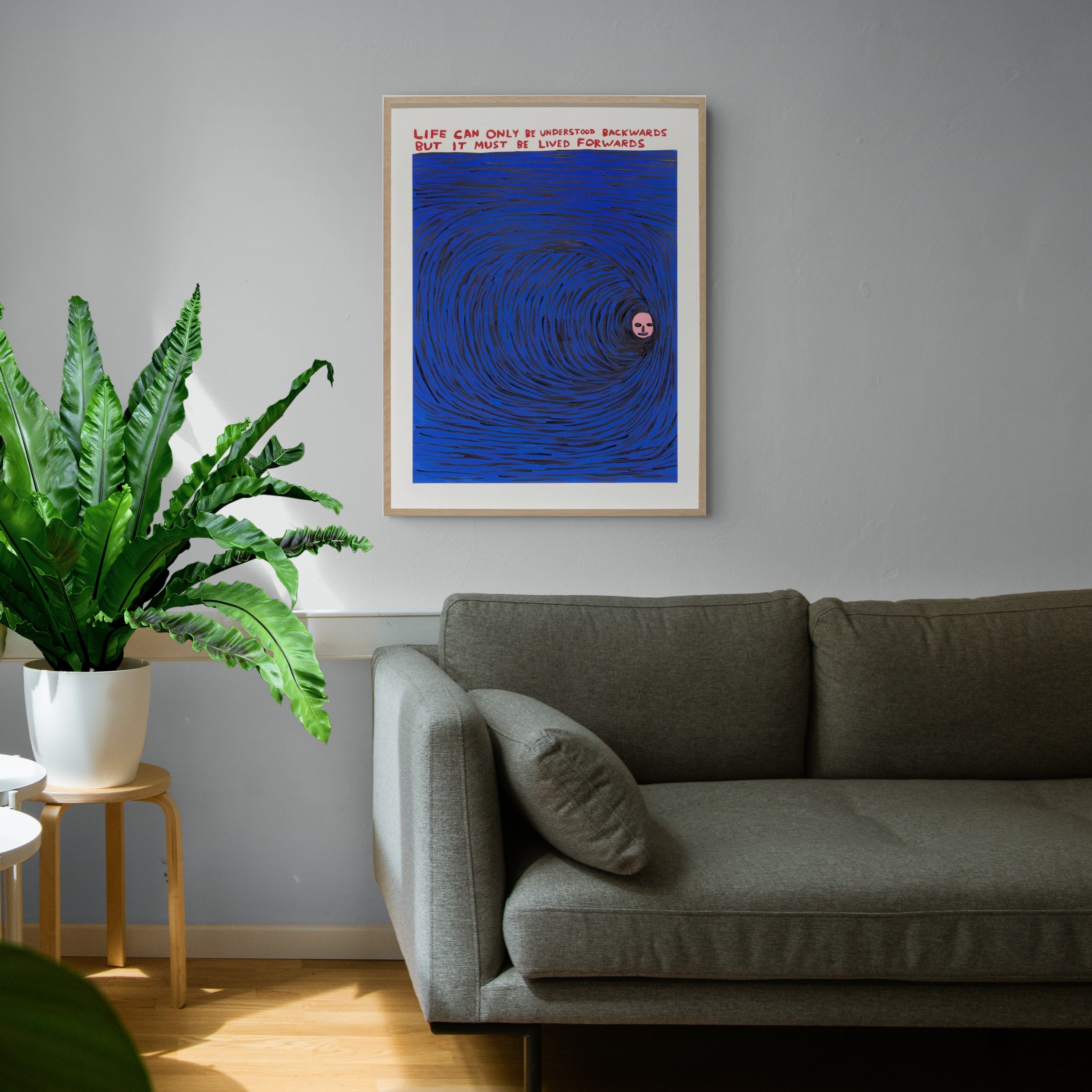 David Shrigley, Untitled (Life Can Only Be Understood Backwards) (2019), screenprint displayed in a modern interior.