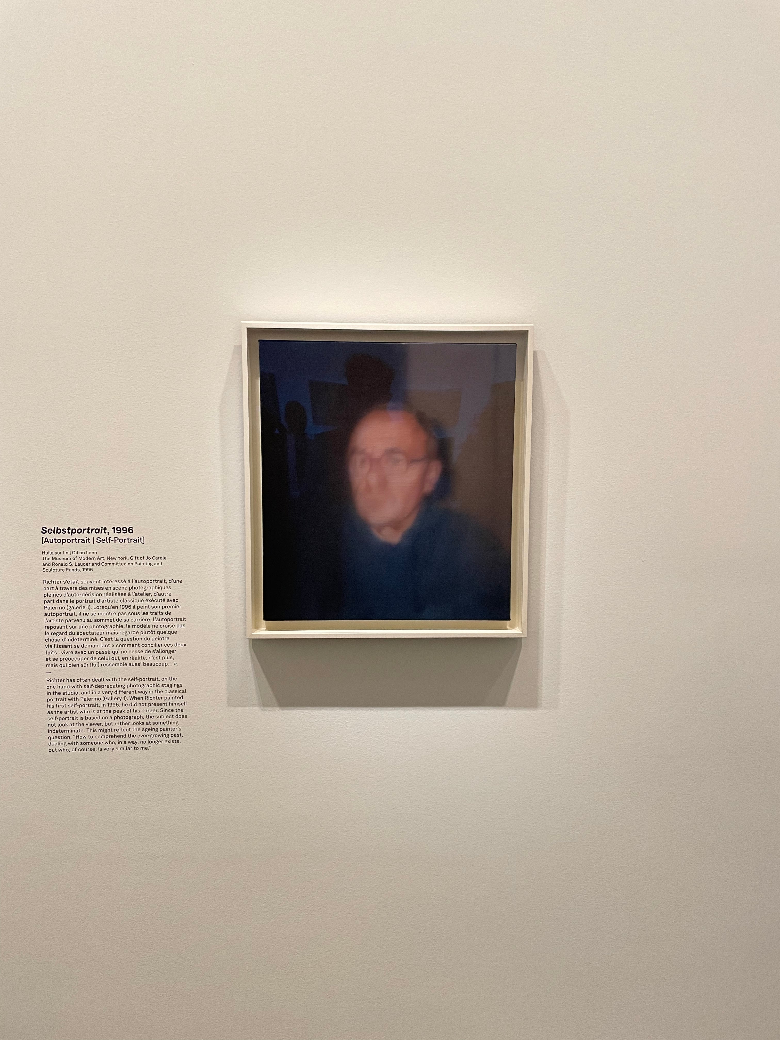 Large Richter canvas reflecting light in the Fondation Louis Vuitton exhibition space in Paris.