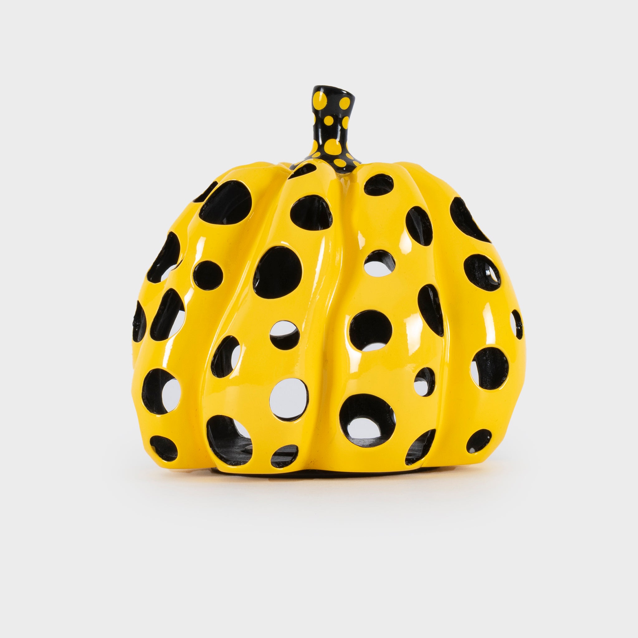 Yayoi Kusama Pumpkin sculpture with black polka dots