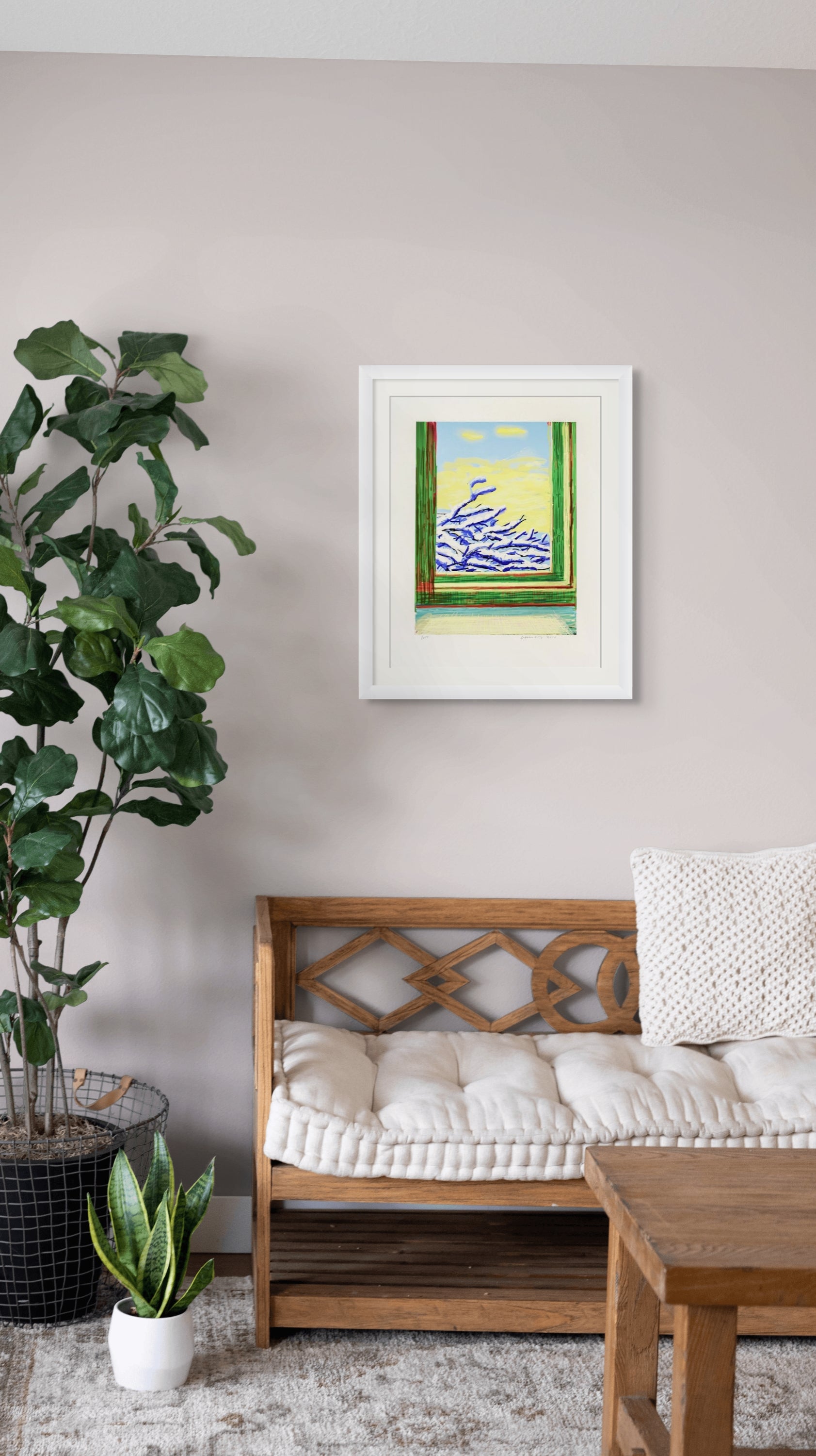 Framed David Hockney ipad drawing abstract painting on a wall above a wooden bench with plants and a table in the foreground.