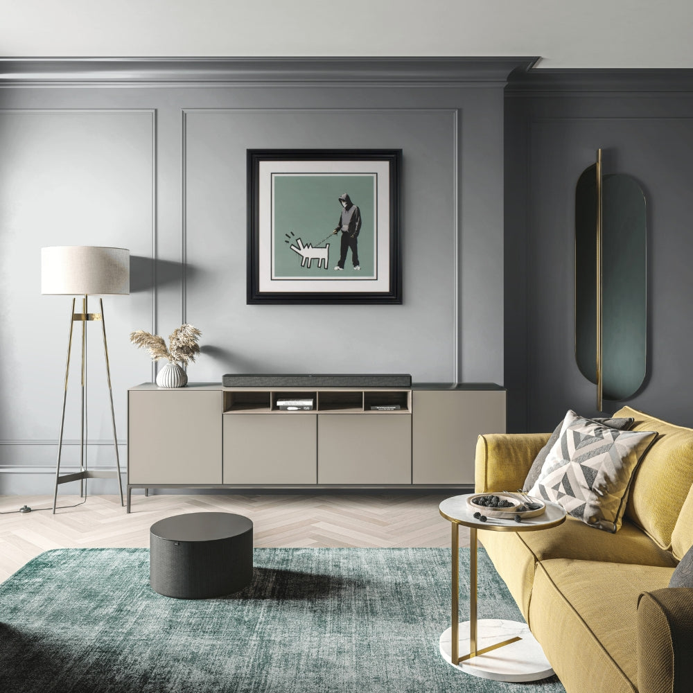 Banksy Choose Your Weapon Slate print displayed in a contemporary interior
