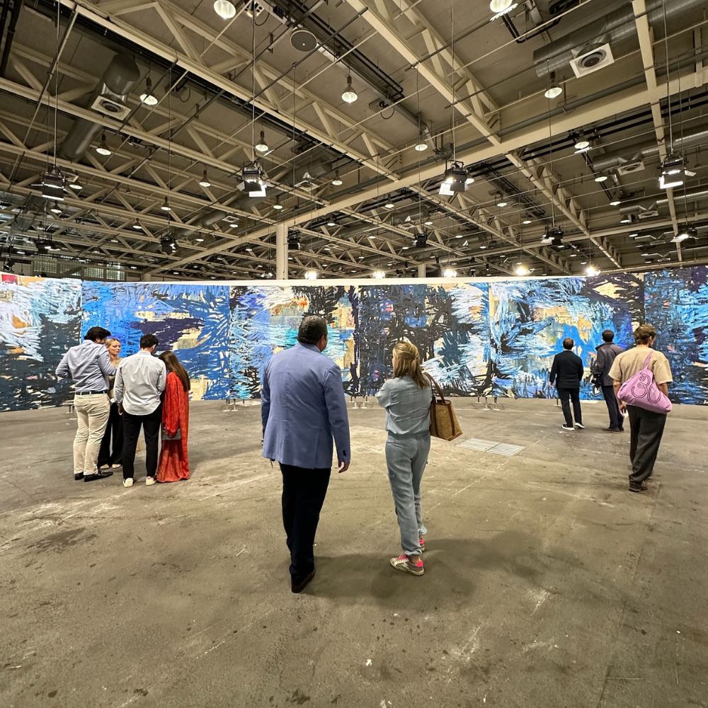 Visitors admiring a blue-chip artwork on display at one of the main gallery sections of Art Basel.