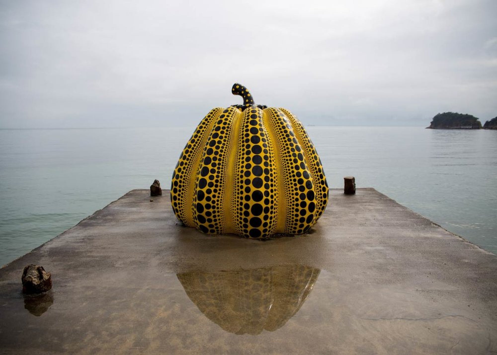 Yayoi Kusama Pumpkin Sculpture by the sea installation