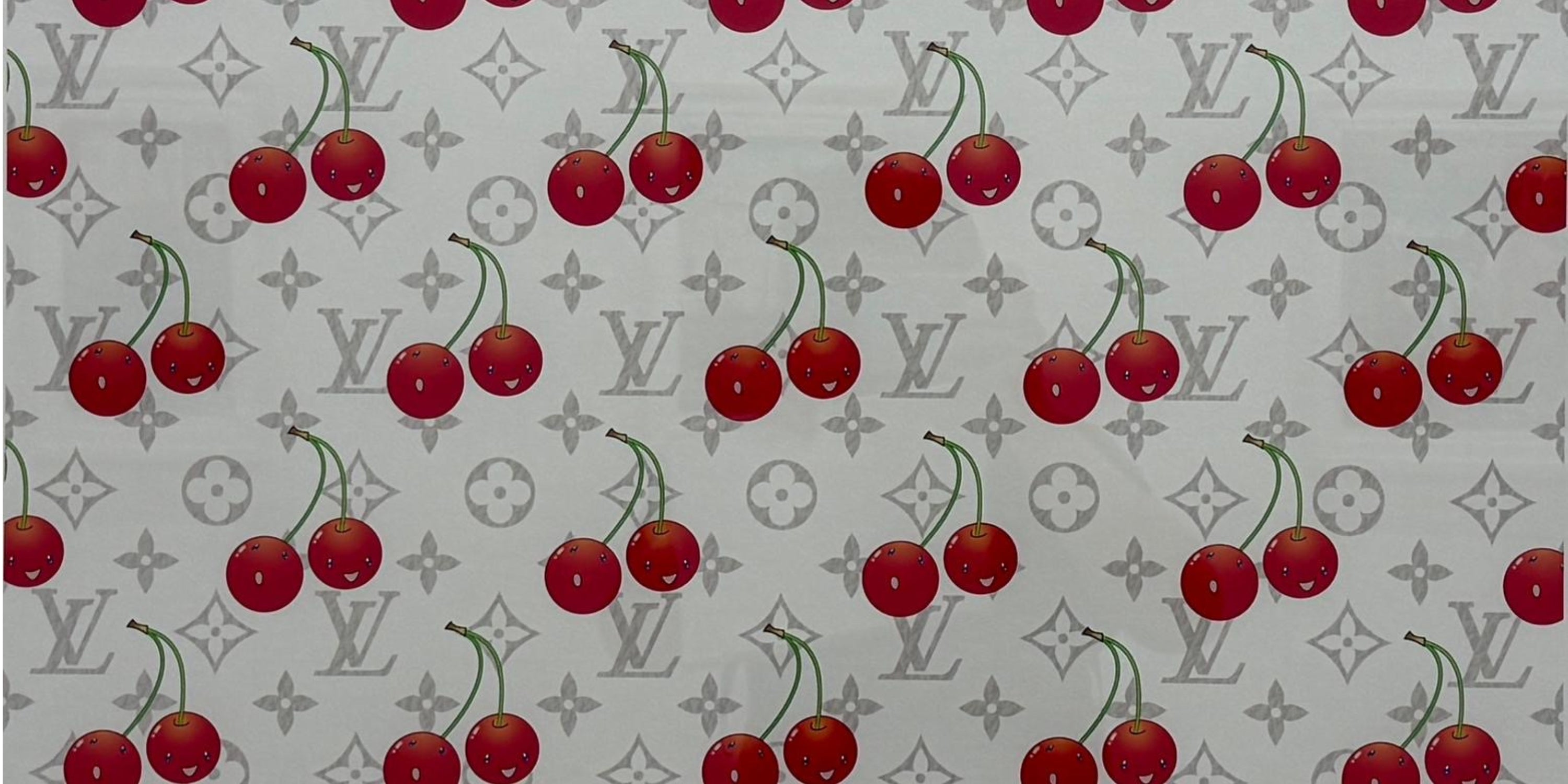Close-up of Takashi Murakami LV Cherry Blue Denim showing vibrant silkscreen colour, Cherry motif and Louis Vuitton Denim Monogram detail.