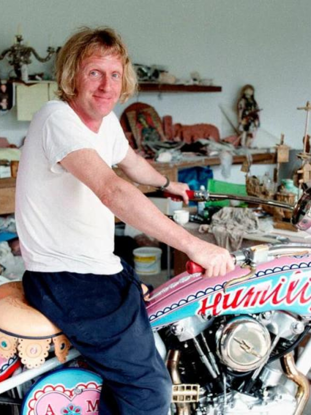 Grayson Perry sitting on motorcycle