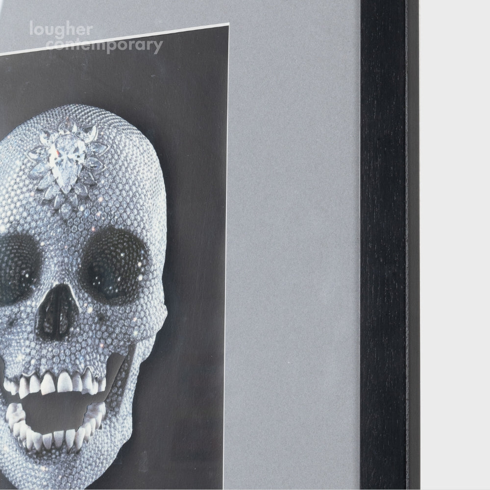 Damien Hirst Skull print exploring themes of mortality, framed with glitter materials