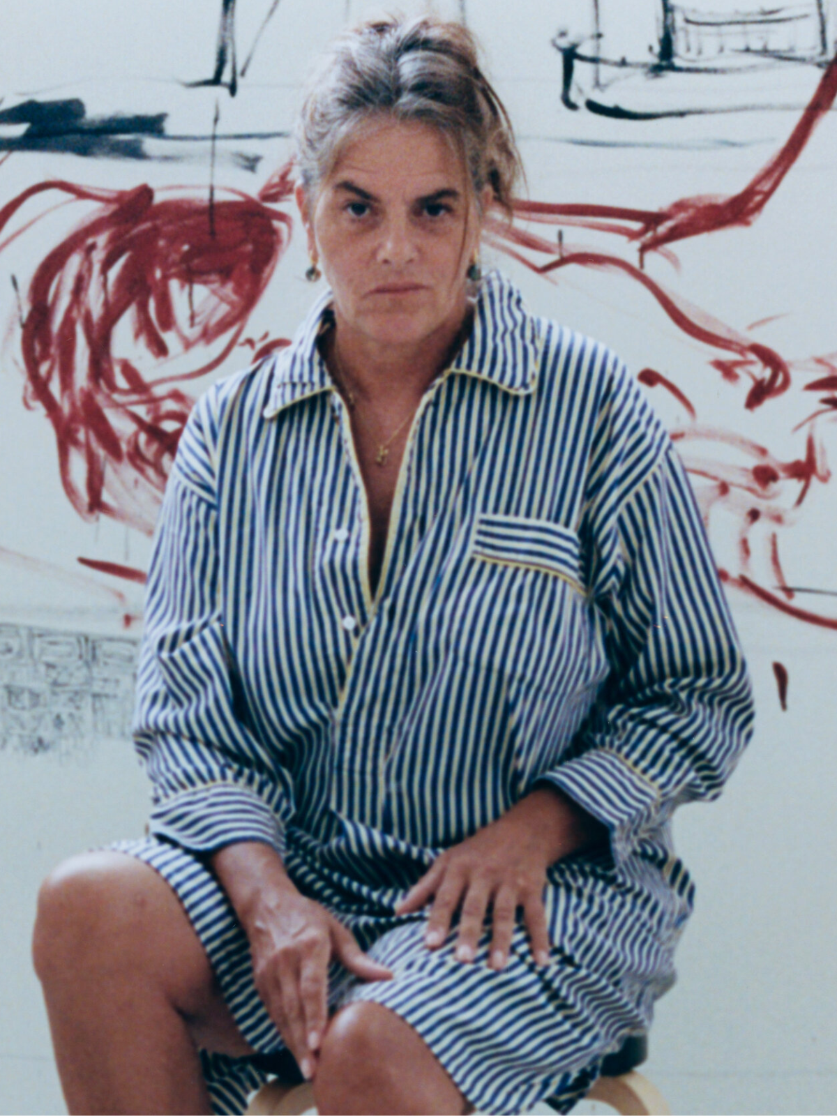 Tracey Emin sitting in her studio