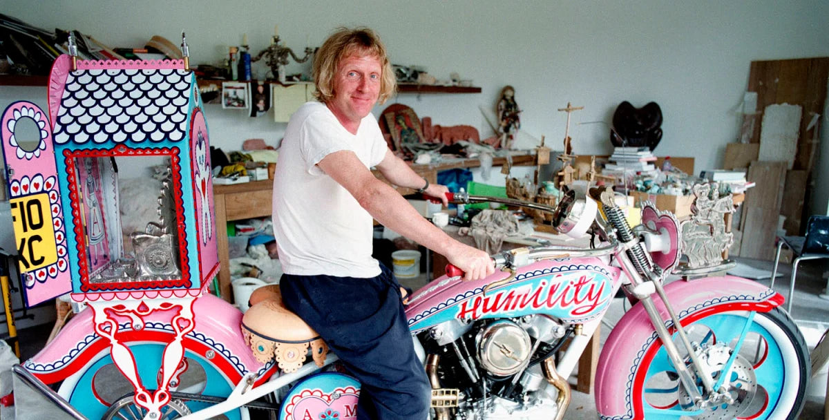 Grayson Perry on pink motorcycle